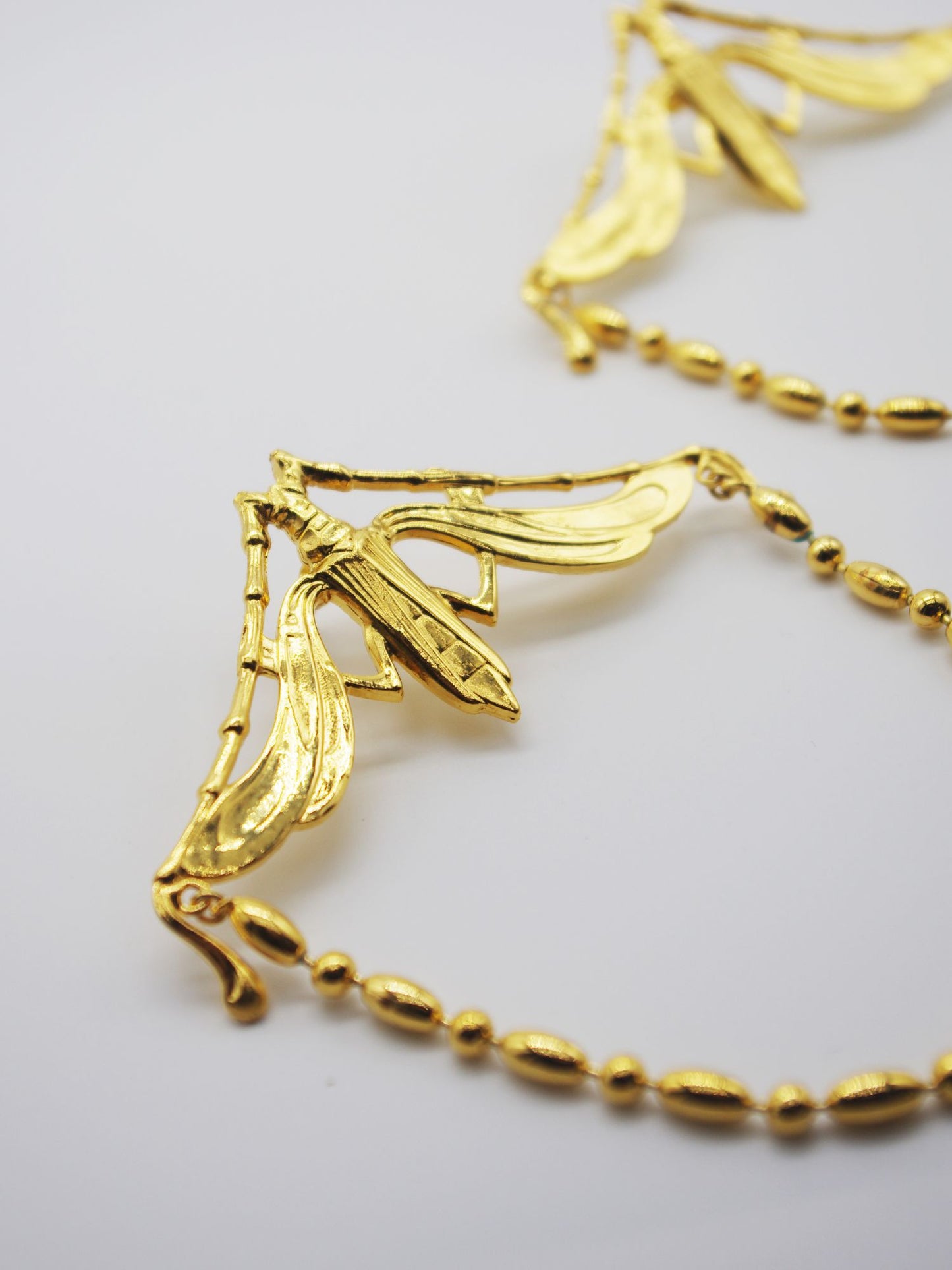 Winged beetle earrings
