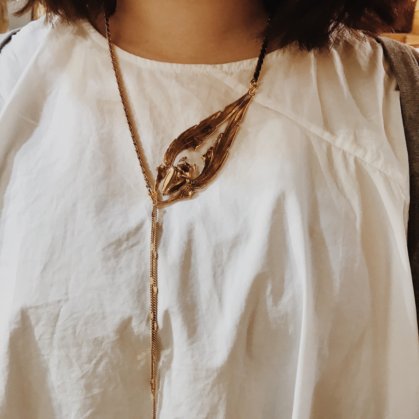 Long golden beetle necklace