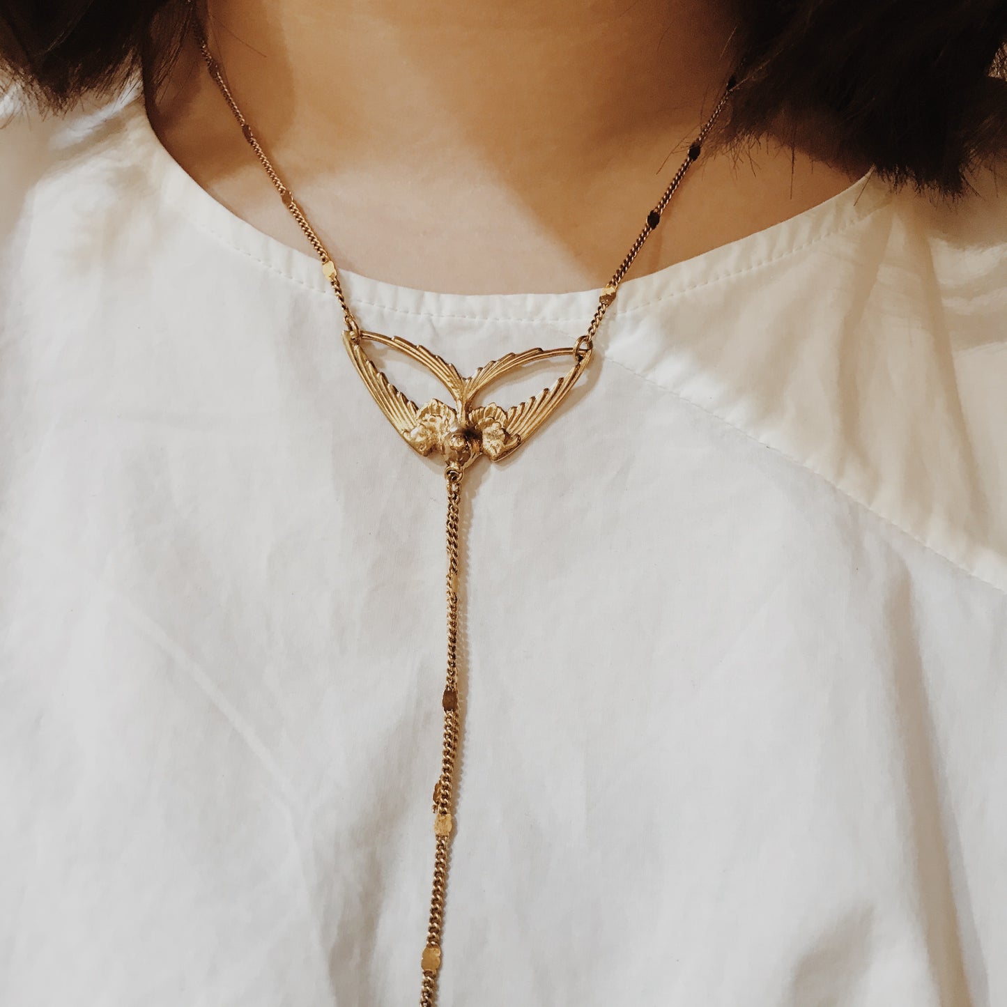 Golden swallow necklace