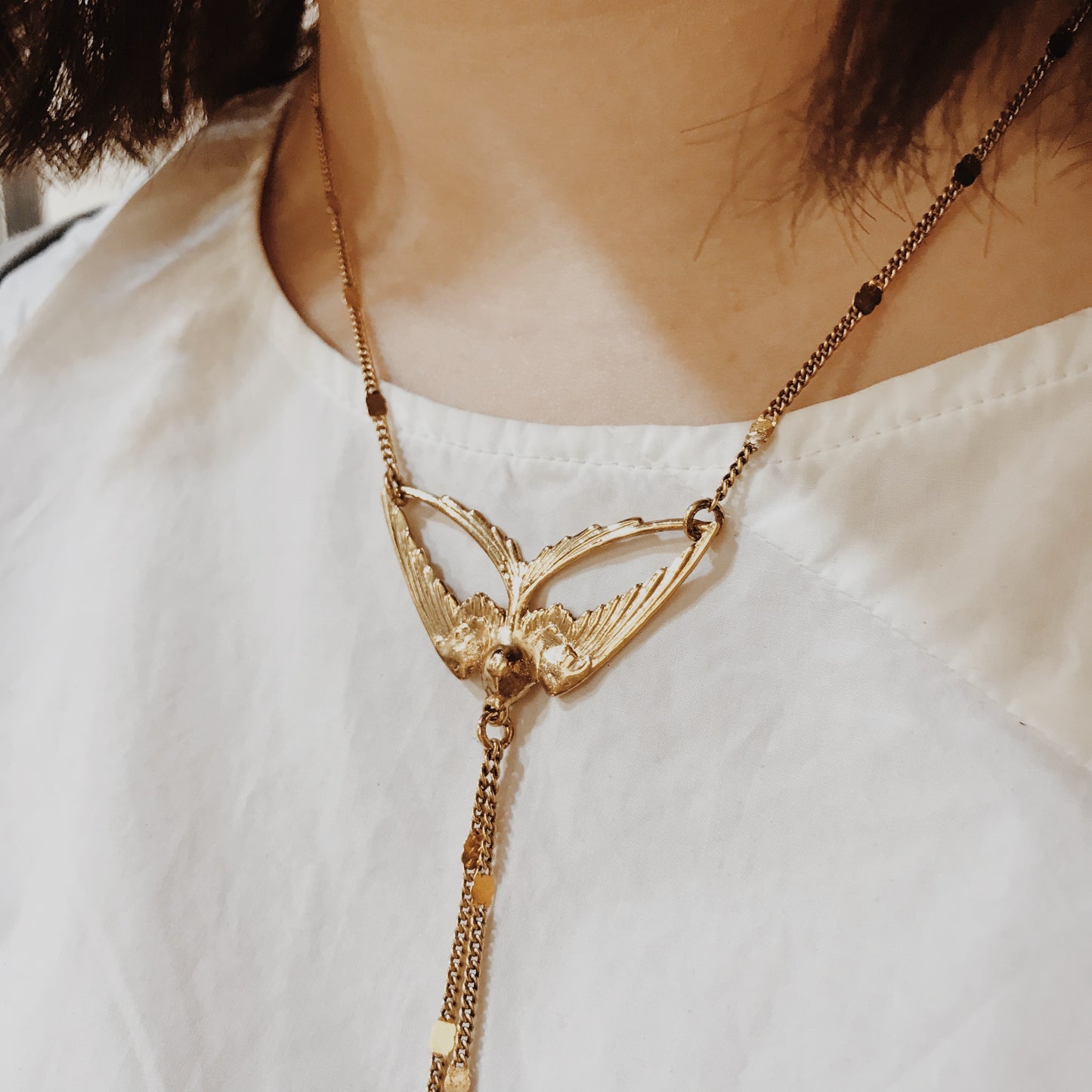 Golden swallow necklace
