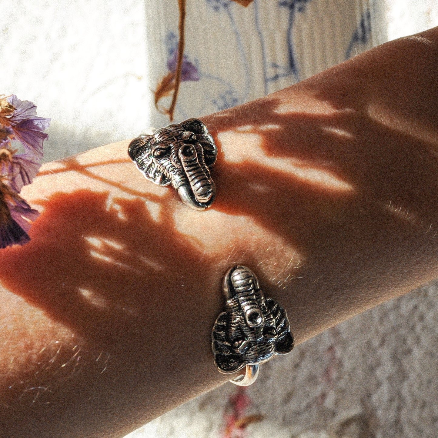 wrist with silver elephant bracelet