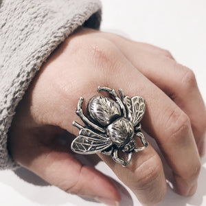 
                  
                    Girl wearing silver bee ring
                  
                