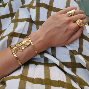 
                  
                    Worn bracelet cicada with butterfly ring and lion ring
                  
                