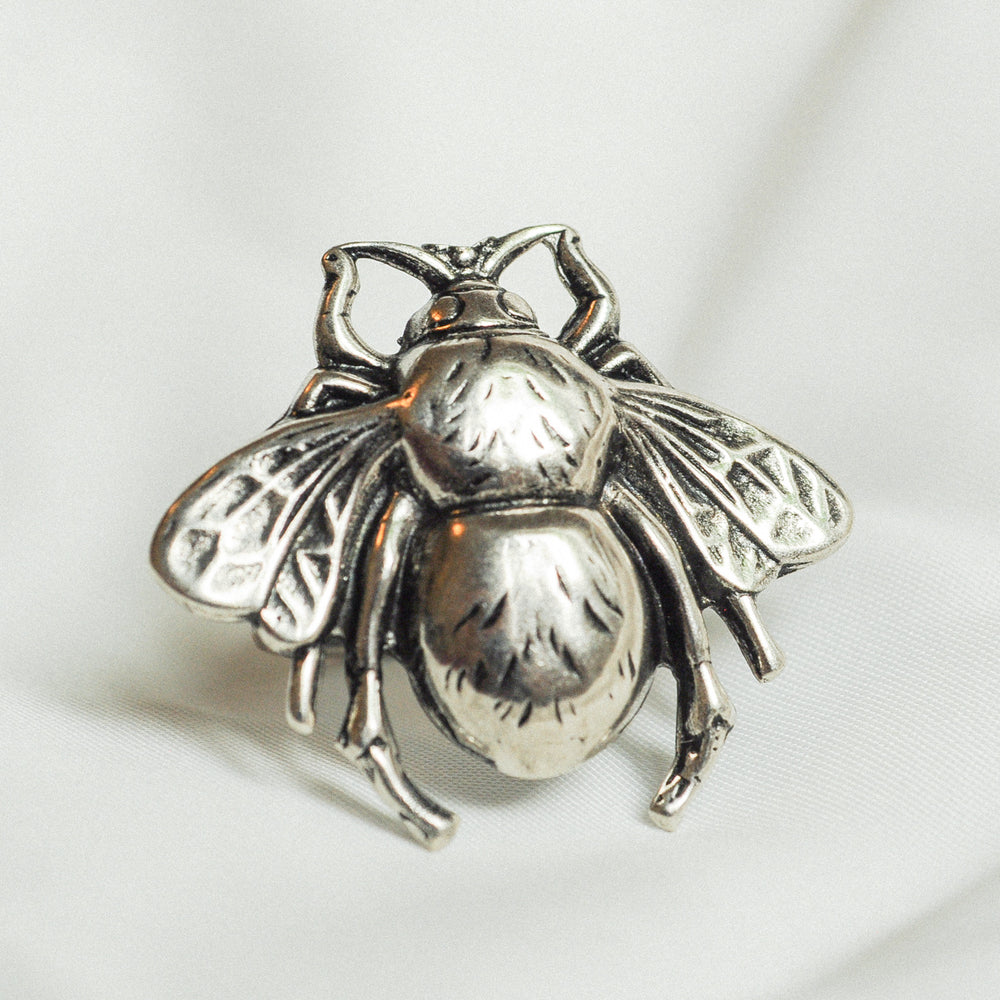 
                  
                    Photo of a silver bee ring
                  
                